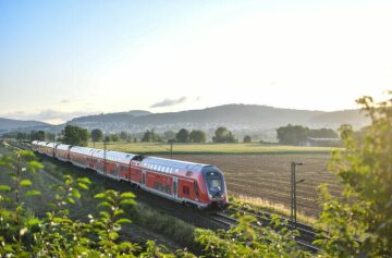 Double-decker train along clear route near Bensheim – DB Regio with Class 445 electric railcar